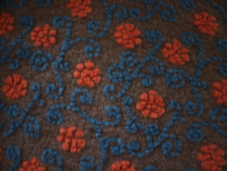 Musterwalk Winter 2025/26 Neu  Blumen auf orange petrol auf taupe Walkloden Italien